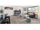 Inviting living room with a cozy fireplace, modern furniture, and a bright window view at 206 Troy St, Aurora, CO 80011