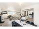 Bright open-concept living and dining area with modern finishes and large windows at 206 Troy St, Aurora, CO 80011