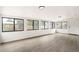 Bright sun room with large windows offering views of the fenced backyard at 206 Troy St, Aurora, CO 80011