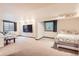 Finished basement with a living area, and a bedroom, with 2 windows at 11412 W Roxbury Pl, Littleton, CO 80127