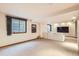 Spacious finished basement with a large window, and entertainment area at 11412 W Roxbury Pl, Littleton, CO 80127