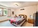 Cozy bedroom with a comfortable bed, soft lighting, and a relaxing atmosphere at 11412 W Roxbury Pl, Littleton, CO 80127