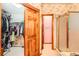 Walk-in closet and bathroom with a shower at 11412 W Roxbury Pl, Littleton, CO 80127