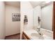 Functional powder room with a classic vanity and a well-lit mirror at 11412 W Roxbury Pl, Littleton, CO 80127