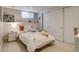Bedroom features a bed, sliding closet doors, and a window at 4456 Yates St, Denver, CO 80212