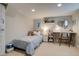Bedroom with bed, desk, and window with lots of natural light at 4456 Yates St, Denver, CO 80212