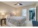 Cozy bedroom featuring a queen bed, ceiling fan and a walk-in closet with ample space at 4456 Yates St, Denver, CO 80212