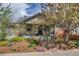 Cozy home with landscaped yard, mature tree, and covered front porch at 4456 Yates St, Denver, CO 80212