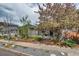 Charming home with a well-manicured front yard, mature trees, and inviting curb appeal at 4456 Yates St, Denver, CO 80212