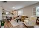 Open concept living room featuring modern furnishings and plenty of natural light at 4456 Yates St, Denver, CO 80212