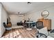 Modern living room setup with hardwood floors, table and seating, with accent lighting at 4456 Yates St, Denver, CO 80212