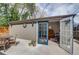 Backyard office space with double doors, an exterior patio area, and wood flooring at 4456 Yates St, Denver, CO 80212