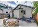 This home has a patio area with an outdoor dining table and grill, perfect for entertaining guests in the backyard at 4456 Yates St, Denver, CO 80212