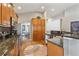 Well-equipped kitchen featuring stainless steel appliances, granite counters, and wood cabinetry at 7141 S Versailles St, Aurora, CO 80016