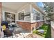Outdoor patio with grilling station, television, and artificial turf at 7141 S Versailles St, Aurora, CO 80016