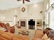 Cozy living room showcases a fireplace, neutral tones, and comfortable seating at 11556 W Cooper Pl, Littleton, CO 80127