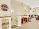 Spacious living room with vaulted ceilings, fireplace, and open staircase at 11556 W Cooper Pl, Littleton, CO 80127