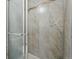 Elegant walk-in shower with beautiful tile work and a glass door at 7740 W 35Th Ave # 210, Wheat Ridge, CO 80033
