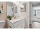 Bright bathroom featuring a single sink vanity with attractive countertop and generous mirror at 7740 W 35Th Ave # 210, Wheat Ridge, CO 80033
