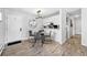 Inviting dining area with stylish table and chairs, enhanced by a modern light fixture at 7740 W 35Th Ave # 210, Wheat Ridge, CO 80033