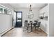 Inviting dining area with stylish table and chairs, enhanced by a modern light fixture at 7740 W 35Th Ave # 210, Wheat Ridge, CO 80033
