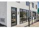 Stylus & Crate building entrance with well-lit storefront and attractive outdoor seating at 7740 W 35Th Ave # 210, Wheat Ridge, CO 80033