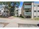 Apartment buildings with green balconies, neutral exteriors, and manicured landscaping at 7740 W 35Th Ave # 210, Wheat Ridge, CO 80033