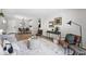 Open floor plan features dining area, chairs, and wood flooring at 7740 W 35Th Ave # 210, Wheat Ridge, CO 80033