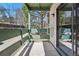 Comfortable outdoor patio area with green wooden railings and open view to trees at 7740 W 35Th Ave # 210, Wheat Ridge, CO 80033
