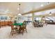 Spacious basement area with entertainment options, including a pool table and kitchenette at 8312 Hackamore Rd, Littleton, CO 80125
