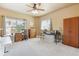 Bright room with a ceiling fan and large window, offering a quiet retreat perfect for relaxation and hobbies at 8312 Hackamore Rd, Littleton, CO 80125