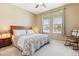 Cozy bedroom with a comfortable bed, carpeting, and natural light from the window at 8312 Hackamore Rd, Littleton, CO 80125