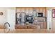 Well-equipped kitchen featuring stainless steel appliances, custom cabinets, and countertop space at 8312 Hackamore Rd, Littleton, CO 80125