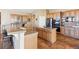 Modern kitchen featuring stainless steel appliances, granite countertops, and custom cabinetry at 8312 Hackamore Rd, Littleton, CO 80125