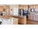 Spacious kitchen with stainless steel appliances, granite countertops, and ample cabinet space at 8312 Hackamore Rd, Littleton, CO 80125