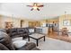 Open concept living area seamlessly integrates kitchen, dining, and seating areas for a spacious and connected living experience at 8312 Hackamore Rd, Littleton, CO 80125