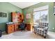 Comfortable office space with a large window, desk, and a sitting chair at 8312 Hackamore Rd, Littleton, CO 80125
