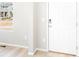 Bright entryway featuring a white door, neutral walls, and light wood-look flooring at 779 N Tempe St, Aurora, CO 80018