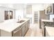 Bright, modern kitchen with stainless steel appliances, an island, and ample cabinet space at 779 N Tempe St, Aurora, CO 80018