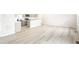 Open-concept living area with hardwood floors seamlessly connecting to the modern kitchen at 779 N Tempe St, Aurora, CO 80018