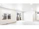 Bright living room with hardwood floors, large windows, and sliding door access to the backyard at 779 N Tempe St, Aurora, CO 80018