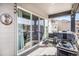 Cozy outdoor deck with a grill, accessible through sliding glass doors to the house at 328 Simmental Loop, Castle Rock, CO 80104