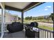 Relax on this back porch with a grill and covered view to the trees and walking path at 328 Simmental Loop, Castle Rock, CO 80104