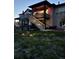 Two-story home featuring backyard with a deck, stairs, and lawn at 328 Simmental Loop, Castle Rock, CO 80104