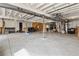 Spacious unfinished basement with exposed ceiling and concrete flooring, ready for customization at 328 Simmental Loop, Castle Rock, CO 80104