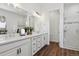 Elegant bathroom features double vanity, quartz countertop, and glass-enclosed shower at 328 Simmental Loop, Castle Rock, CO 80104