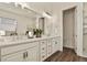 Bright bathroom with a double vanity, modern fixtures, and clean lines, offering a luxurious and functional space at 328 Simmental Loop, Castle Rock, CO 80104