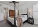 Serene bedroom with a four-poster bed, ample natural light, and closet access at 328 Simmental Loop, Castle Rock, CO 80104