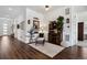 Stylish entryway featuring wood floors, a curated bar area, and decorative accents creating a welcoming atmosphere at 328 Simmental Loop, Castle Rock, CO 80104