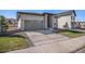 Charming home with a two car garage, stone accents, and a well-maintained front lawn at 328 Simmental Loop, Castle Rock, CO 80104